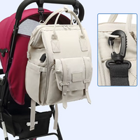 Sac à langer bleu à motifs jaunes, noir et  rose - BabyCarry