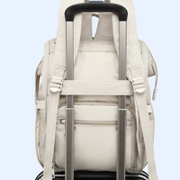 Sac à langer bleu à motifs jaunes, noir et  rose - BabyCarry